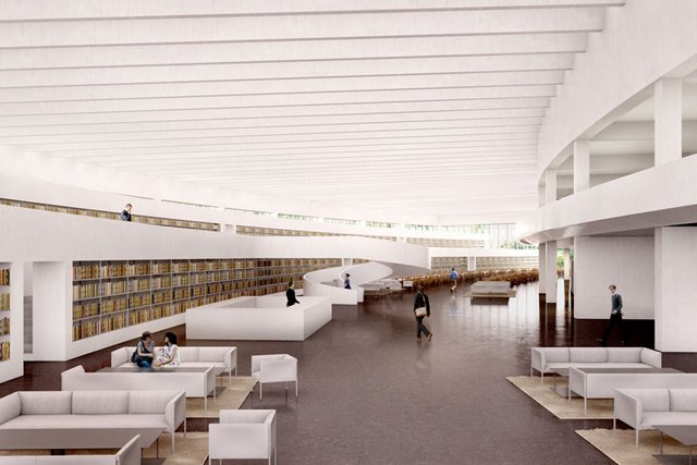 Une longue salle avec des sièges et des rangées de livres, un escalier et une coursive.
