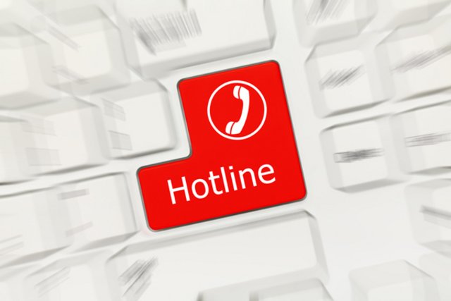 illustration: mot "hotline" inscrit sur une touche de clavier d'ordinateur.