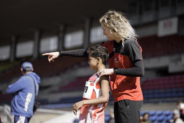 Fist, motivation or team support in netball training game scream formation sport
